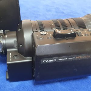 A Canon HJ40x14BIASD-V HD Broadcast Zoom Lens (USED) sits on a blue surface, control buttons and lens markings visible—ideal for professional dealers or outfitting new mobile broadcast production vehicles.